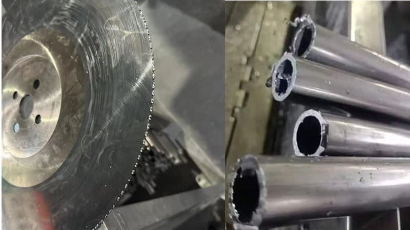 A saw blade with sticky, gummed-up teeth next to a thick metal pipe